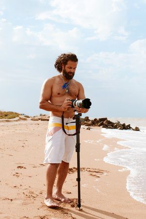 Photographer takes pictures on the beach