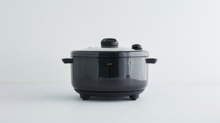 Modern electric slow cooker on a white background with a clear view