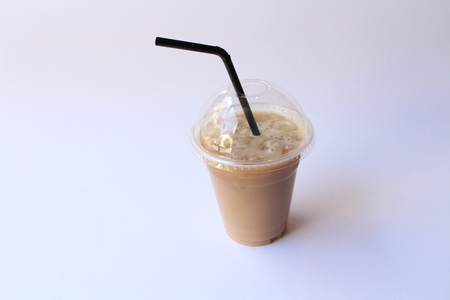 Take away glass of iced coffee with a straw.の写真素材