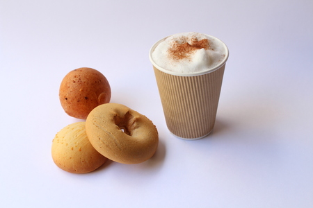 Take away capuccino coffee with some traditional colombian pastries, usually served for breakfast. Almojabana, buÃ±uelo and pandebono.の写真素材