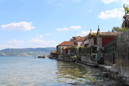 Beautiful village of Combarro in Spain unique for its horreos, traditional granary barnsの写真素材