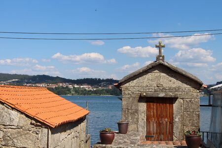 Beautiful village of Combarro in Spain unique for its horreos, traditional granary barnsの写真素材