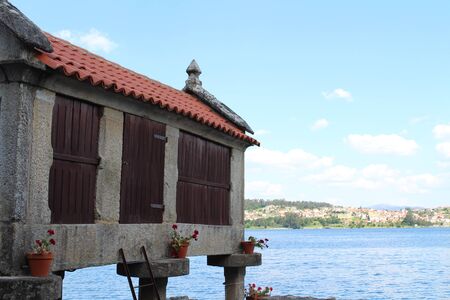 Beautiful village of Combarro in Spain unique for its horreos, traditional granary barnsの写真素材