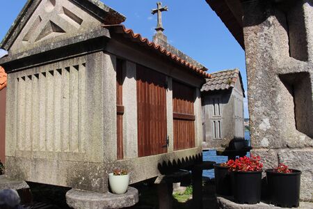 Beautiful village of Combarro in Spain unique for its horreos, traditional granary barnsの写真素材