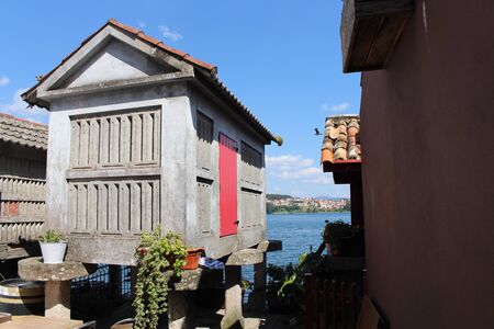 Beautiful village of Combarro in Spain unique for its horreos, traditional granary barnsの写真素材