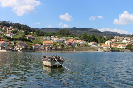 Empty and solitary boat on the waterの写真素材
