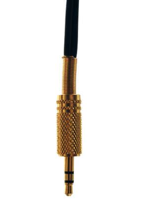 Gold-plated 3.5 mm audio jack on white backgroundの写真素材