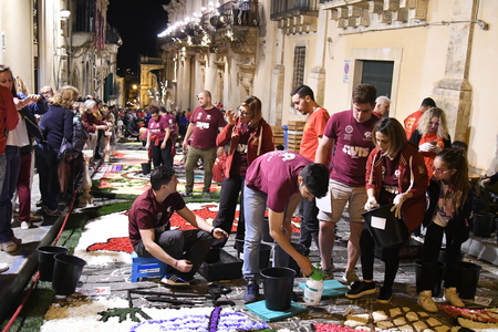 NOTO, ITALY - MAY 19th 2018: The famous Infiorata, in Noto, the town in Sicily famous for its baroque. Artists associations are creating drawings with flowers and petals in the gorgeous Via Nicolaci.のeditorial素材