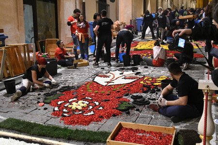 NOTO, ITALY - MAY 19th 2018: The famous Infiorata, in Noto, the town in Sicily famous for its baroque. Artists associations are creating drawings with flowers and petals in the gorgeous Via Nicolaci.のeditorial素材