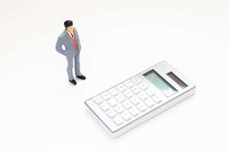 Calculator and a businessmanの写真素材