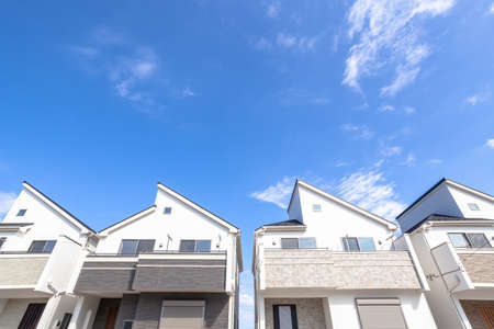 Blue sky and newly built houses image materialの写真素材