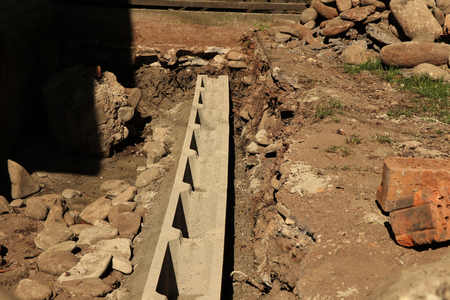 Working place. Building new house. Brick line as foundationsの写真素材