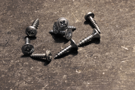A many steel nails lying on the working desk ready for usingの写真素材