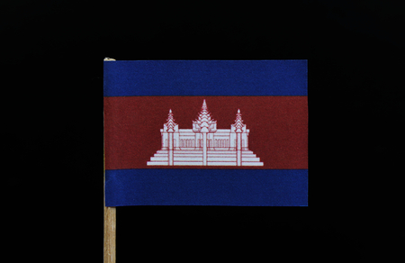 A original and unique flag of Cambodia on toothpick on black background. Three horizontal bands of blue, red  and blue, with a depiction of Angkor Wat in white centred on the red bandの写真素材