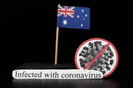 Australia is infected with covid-19, Severe acute respiratory syndrome coronavirus. Flag of Thailand on wooden stick and cell of disease. Epidemic of coronavirus disease 2019 across world.の写真素材