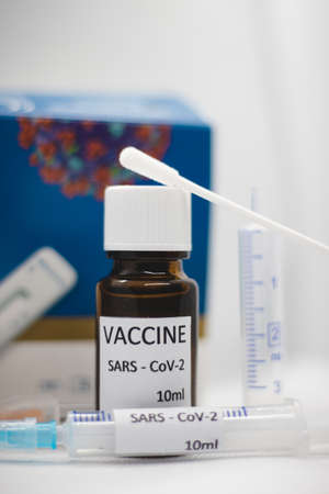 Close-up medical syringe with a vaccine. Vaccine ampoule full of anti-virus medicine, ready for...