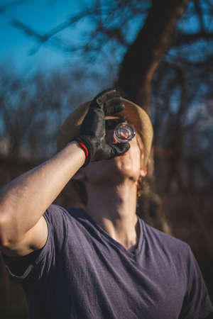 Sipping slivovitz after a hard day's work in the countryside on a normal beautiful sunny day with a neighbor. Maintaining good relations between neighbors. Casual day in czech republic.の写真素材