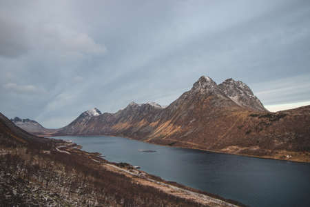 View of the bay with the village of Gryllefjord in the Andsfjord area on the Senja peninsula in northern Norway. Scandinavian landscape.の写真素材