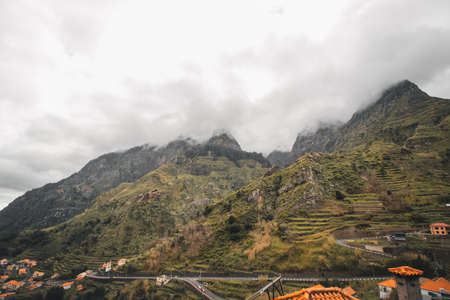 view from the mountain road of the town of Serra de Agua immersed in foggy weather in the middle of...
