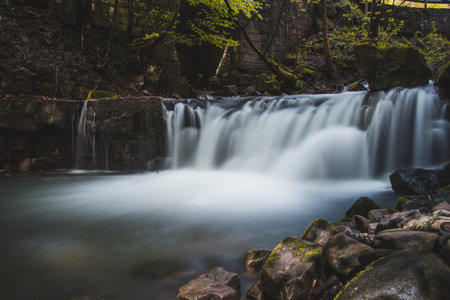 Famous Satiny waterfalls. Breathtaking, untouched nature around the water flowing down cascades...