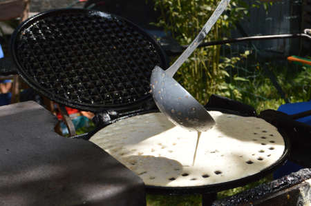 The making of a gofres, a typical piedmont foodの写真素材