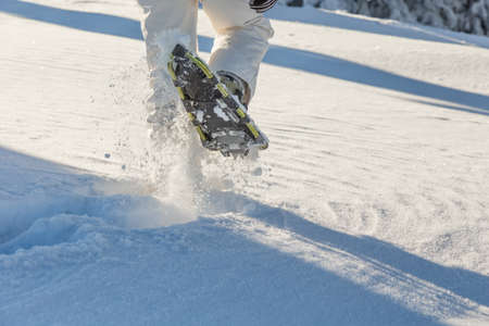 Girl snowshoeing on a sunny dayの写真素材