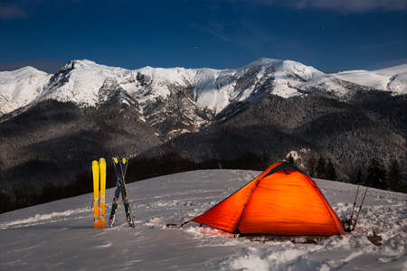 Full moon camping in the snow after a day of backcoutry skiing in Osleaの写真素材