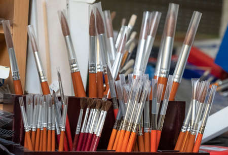 batch of brushes exposed in wooden displayのeditorial素材