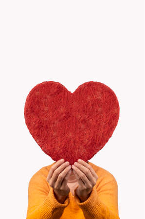 woman holding big heart between her hands, concept valentines day