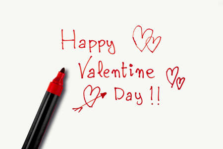 Valentine's Day phrase made with a red marker on a white background. Concept of St. Valentine's Dayの写真素材