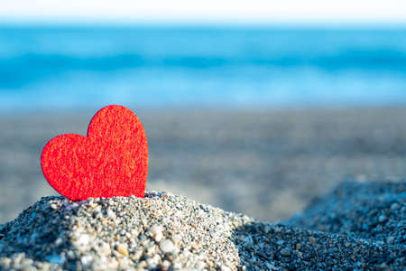 red heart on a mountain of sand by the sea, concept of san valentineの写真素材