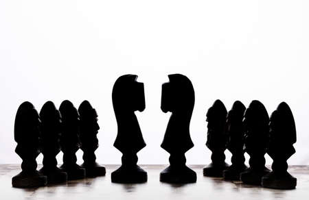 silhouettes of chess pieces on a white background