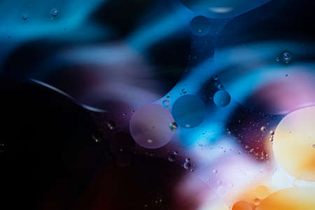 Abstract background with vibrant colors. Oil drops in water. Close colorful and artistic bubbles. Space pattern.の写真素材