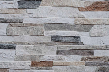 Natural facade stone decoration quartzite background texture. modern granite stone wall