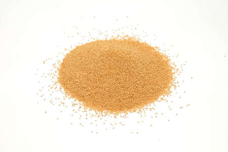 Amaranth grains pile isolated on white backgroundの写真素材