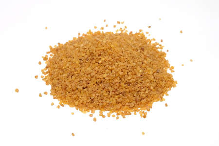 Bulgur grains pile isolated on white backgroundの写真素材