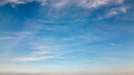 Blue sky background with tiny clouds. Nature composition. Panoramic image.の写真素材