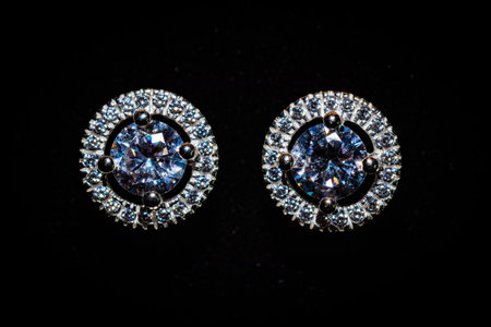 Jewelry earrings with diamonds on a black background close upの写真素材