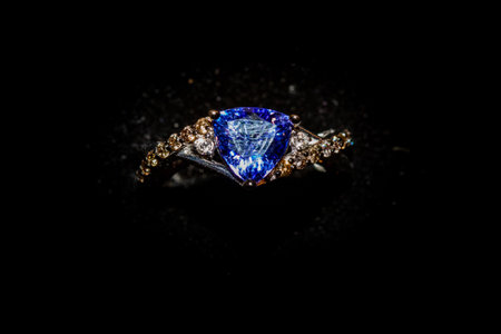Jewelry ring with blue sapphire on a black backgroundの写真素材