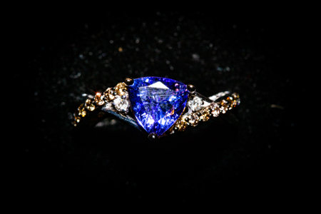 Jewelry ring with blue sapphire on a black backgroundの写真素材