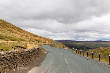 Road on the Isle of Skye in Scotland in a cloudy dayの写真素材