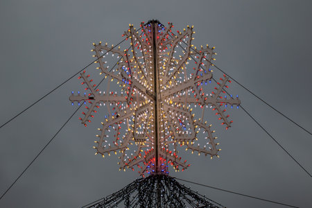 Christmas decoration in the form of a snowflake with multi-colored lightsの写真素材