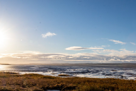 Icelandic landscape with lake and blue sky at sunset time.の写真素材