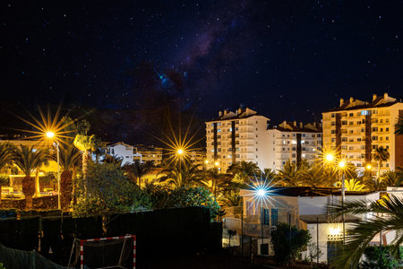 Night starry sky with Milky Way over the houses in Gran Canariaの写真素材