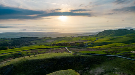 Aerial view of the sunrise over the rolling hills in the English countrysideの写真素材