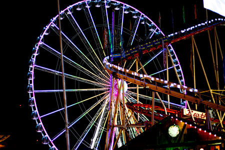 Ferris wheel at night in the amusement park, closeup of photoの写真素材