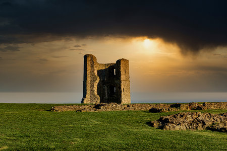 Ruins of medieval castle at sunset, County Clare, Ireland.の写真素材