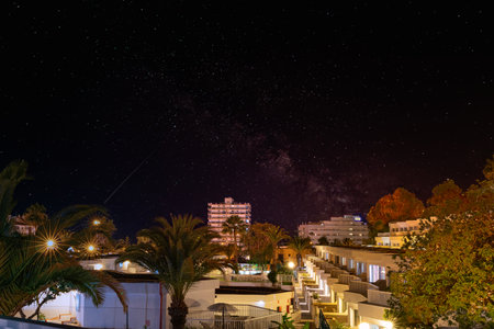 Night starry sky over the city, Crete, Greece.の写真素材