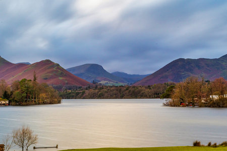 Beautiful landscape image of Lake District with mountains in the background during winterの写真素材