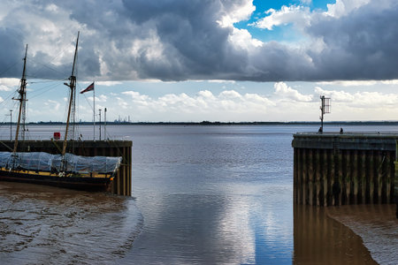 Fishing boats moored to a pier on the North Sea.の写真素材